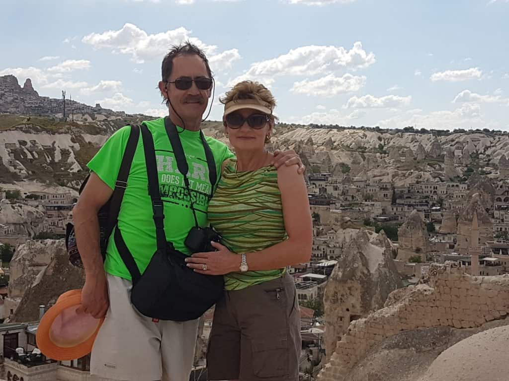 Couple overlooking the town from the  viewpoint in Göreme, Cappadocia 