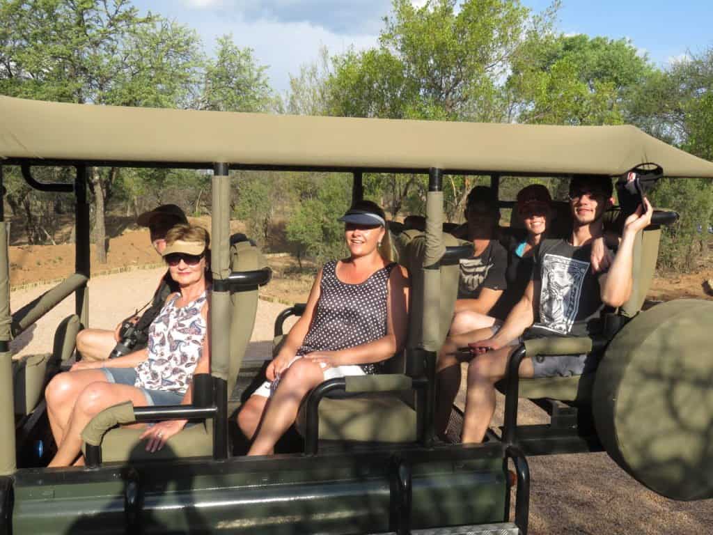 People in open vehicle going on Dinokeng Game drives