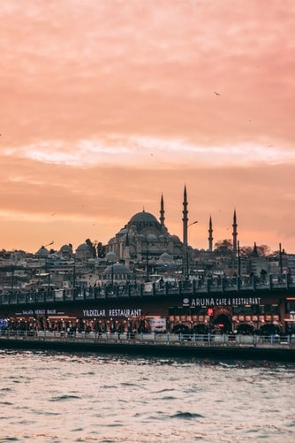 sunset view over bridge with restaurants Istanbul