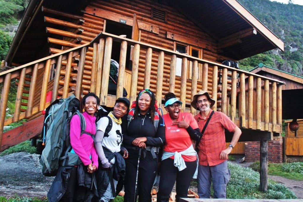 A Group of hikers in front of one of the Huts on the Otter Trail