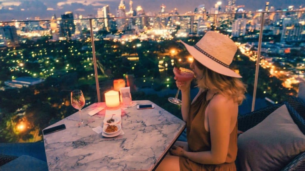 Lady enjoying a drink at a top Rooftop bar Istanbul