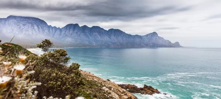 Clear sky, blue ocean and Mountains in the Garden Route of South Africa