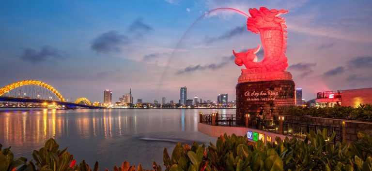 Red dragon spitting water in River Danang bridge in Da Nang Vietnam