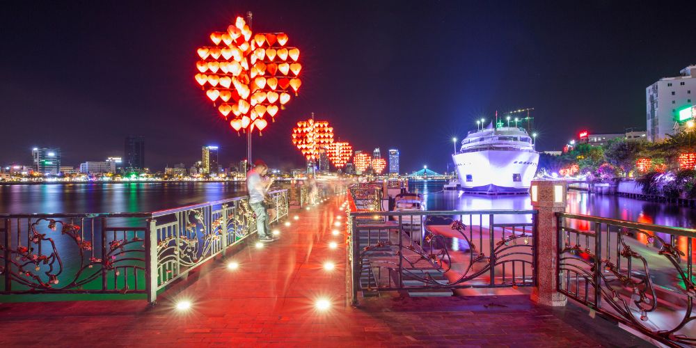 A Bridge on the Han River in da Nang Vietnam with pillars from where hundreds of red glass harts hang. Love Bridge Da nang #lovebridgdanang