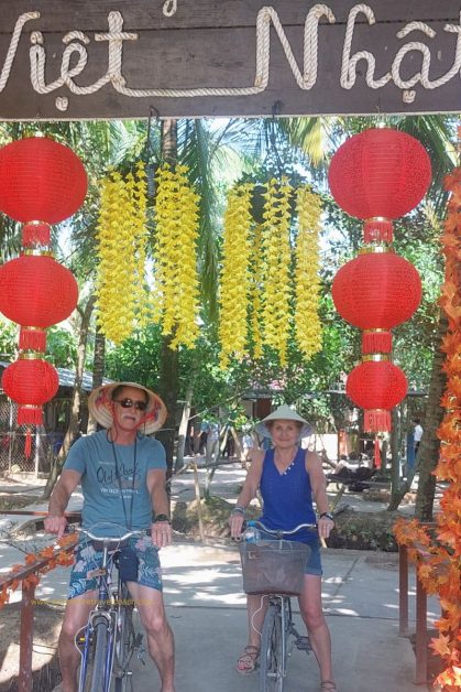 Couple cycling on the Mekong Delta Island in Vietnam Travel Planner Itinerary