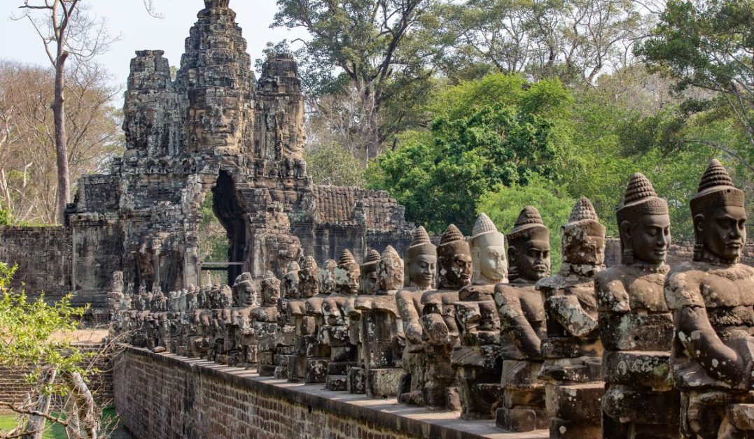 Bayon Angkor Wat entrance with statues lined up