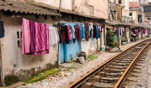 Vietnam suburb next to railway line with washing - back of Vietnam street