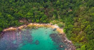 boat in crystal blue water at Beach in Phu Quoc Vietnam