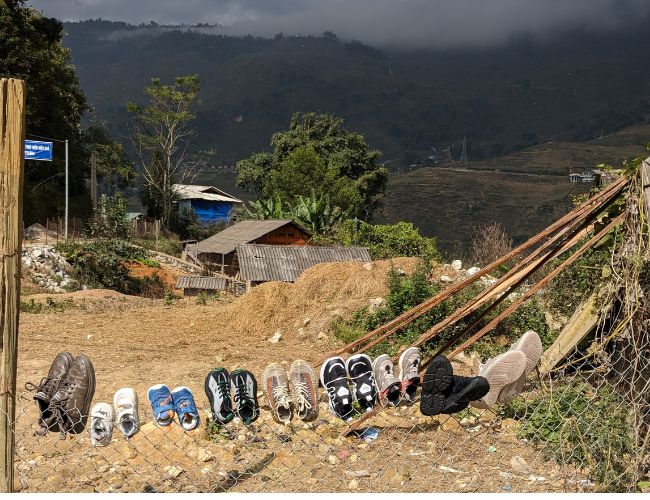 Sapa Village Northern Vietnam with shoes of locals hanging on the wire to dry #sapanorthernvietnam