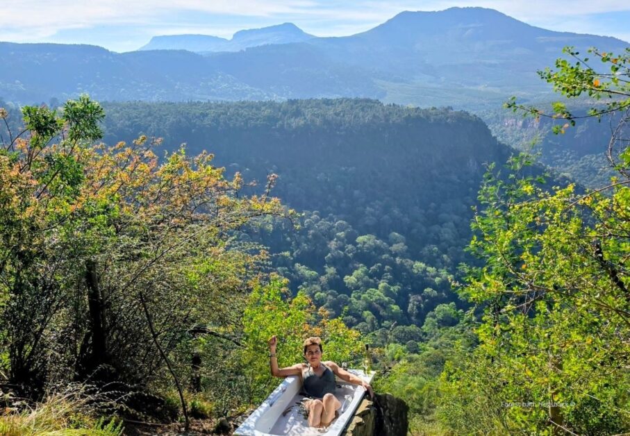 Woman in Forest Bath at Away with the fairies with Hogsback Mountain view #Fairytalehogsback #hogsbackbath